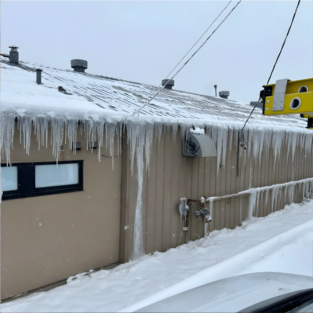 Dangerous roof icycle ice dam snow problems in Calgary
