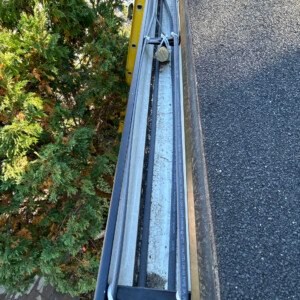 Top-down view of heavy-duty commercial gutter heat tracing and cable channel routing.