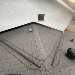 Professional heat tape installation covering multiple intersecting roof valleys to ensure proper winter drainage and prevent ice damming.