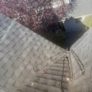 Self-regulating heat cable system installed down a steep residential roof valley for winter drainage protection.